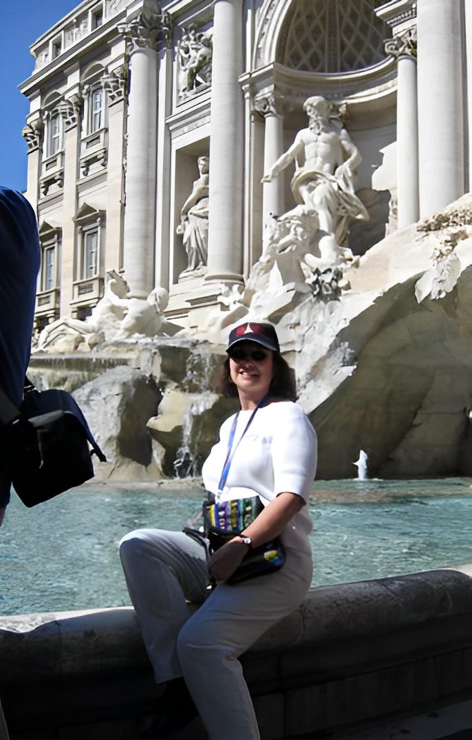 Person posing at Trevi Fountain, Rome.
