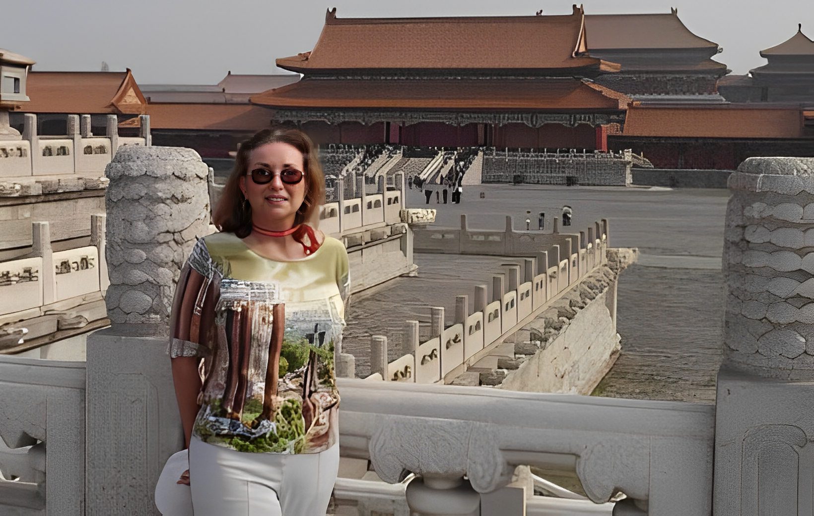 Woman posing in front of ancient architecture.