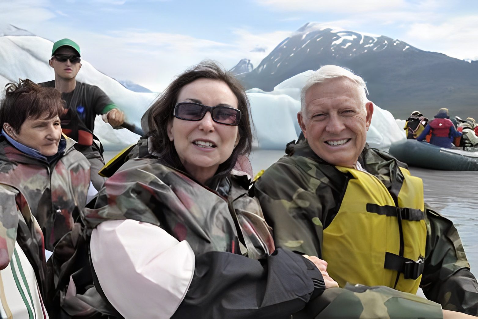 Group enjoying boat ride in icy waters.