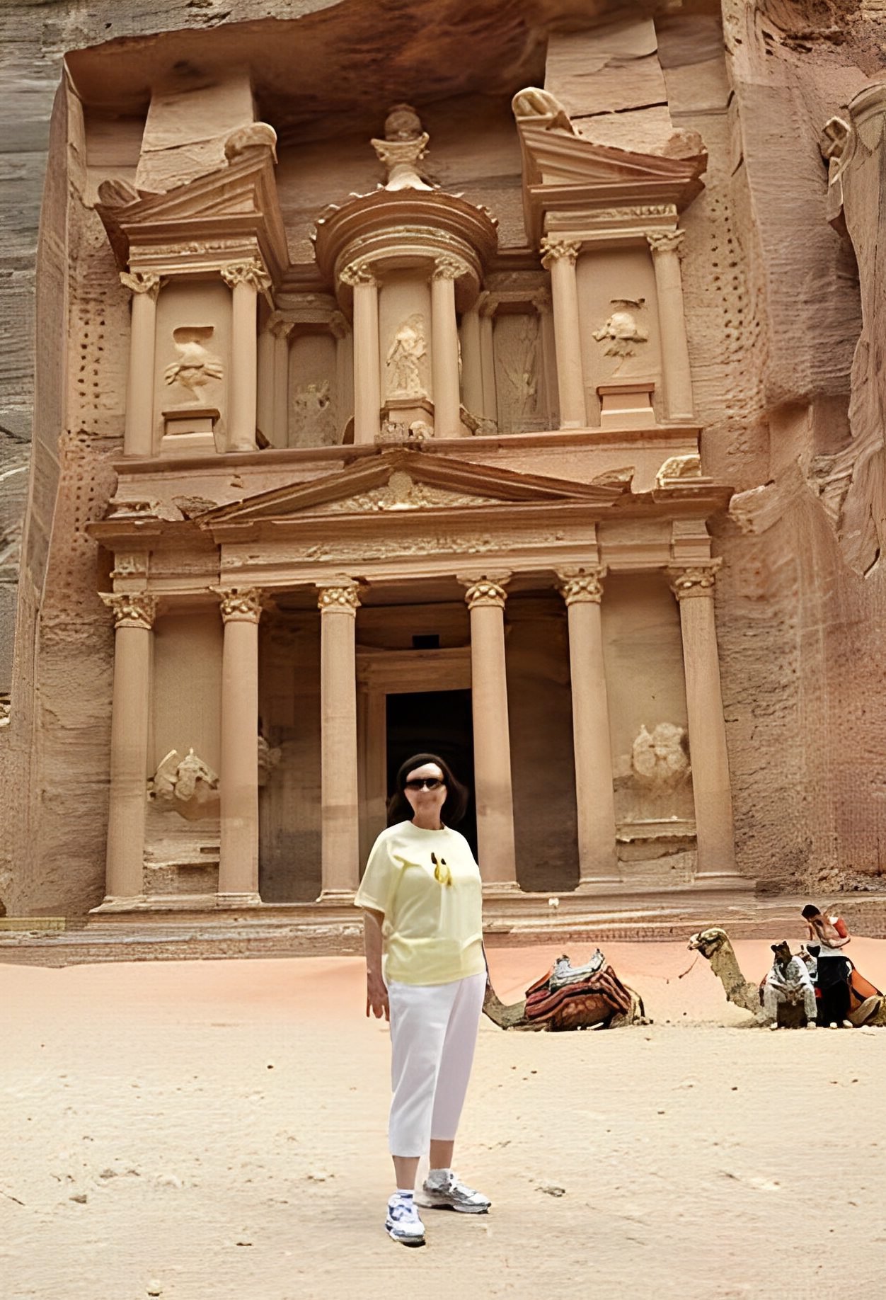 Person standing in front of Petra Treasury.
