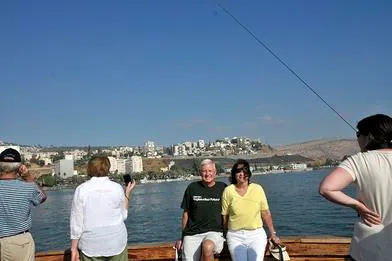 People enjoying a boat ride on water.