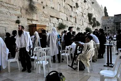 People praying at the Western Wall.