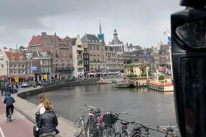 Canal with bicycles and historic buildings nearby.