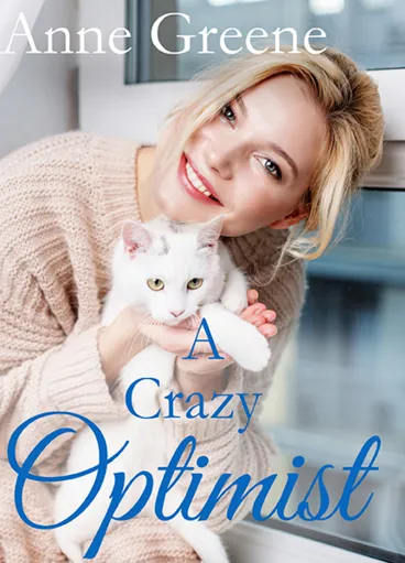 Woman smiling with a white cat.