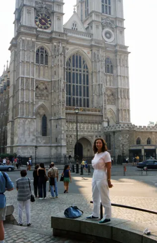 Person standing near historic cathedral building.